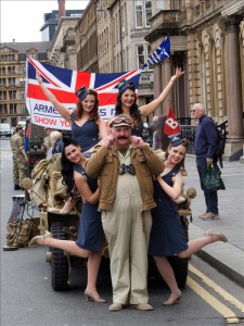 Dance troupe The Kennedy Cupcakes pose with WW2 Re-enactors at the Armed Forces Day event in Glasgow.