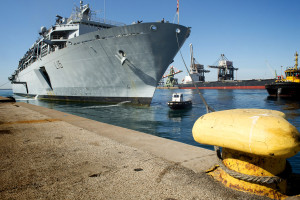 HMS Bulwark arrives in Taranto, Italy on 30th May 2015 to disembark rescued migrants following their rescue in the Mediterranean on 28th May.