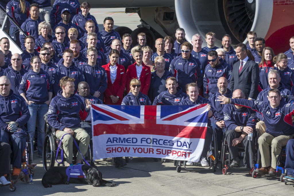 Team Invictus pose with the AFD flag