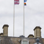 Armed Forces Day and Pride flags and flying over government buildings in Whitehall in London.