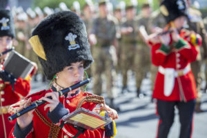 Members of the Armed Forces playing the military band as part of an Armed Forces Day parade. 