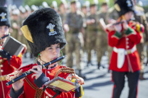 Members of the Armed Forces playing the military band as part of an Armed Forces Day parade.