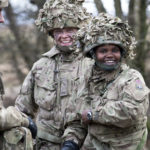 Personnel from the 1st Regiment, Royal Horse Artillery share a joke.